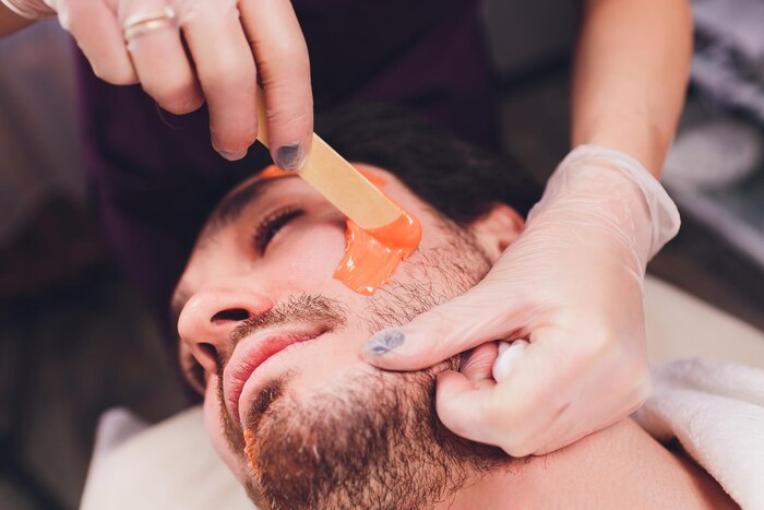 hair-removal-man-s-face-sugaring-epilations-beard-trimming-yellow-color-cosmetology-couch_152904-48125 Men's Sugaring